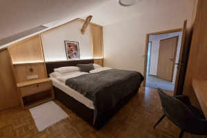 Jedna z ložnic v apartmá Jedna z ložnic v apartmá